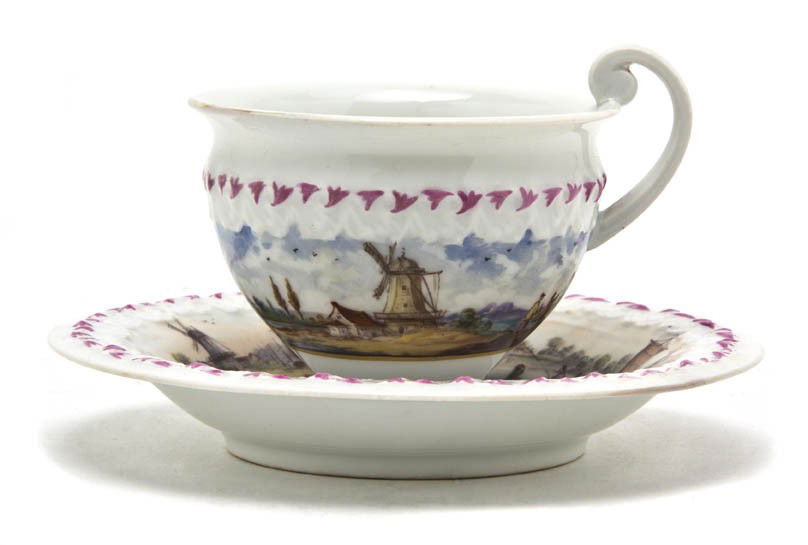 A Meissen Porcelain Cup and Saucer, Diameter of s: A Meissen Porcelain Cup and Saucer, each decorated with a port scene depicting ships and windmills, having crossed swords mark in underglaze blue. Diameter of saucer 5 1/2 inches. Property from the Co