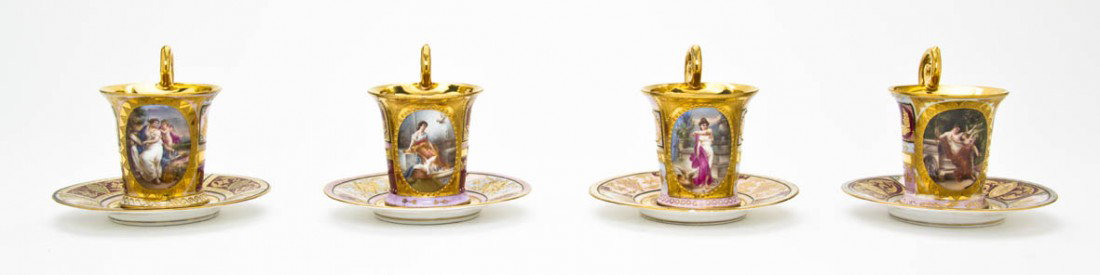 A Set of Ten Royal Vienna Porcelain Cups and Sauc: A Set of Ten Royal Vienna Porcelain Cups and Saucers, each having an oval cartouche depicting a figural scene, signed Wagner, with bead and gilt decoration throughout. Height of cup 3 1/3 inches. Prop