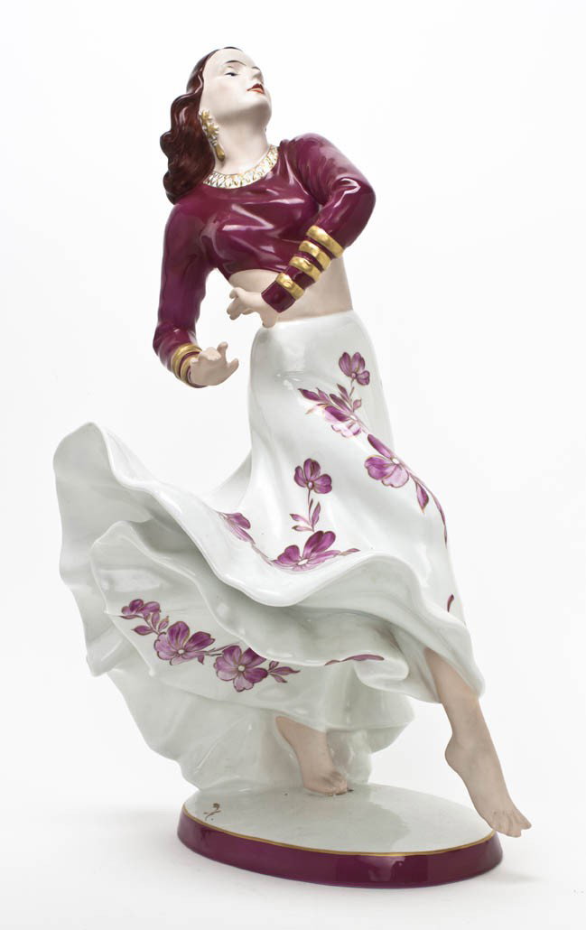 A Royal Dux Porcelain Figure, Height 23 3/4 inche: A Royal Dux Porcelain Figure, depicting a barefoot dancer wearing bangles, set on an oval base. Height 23 3/4 inches.