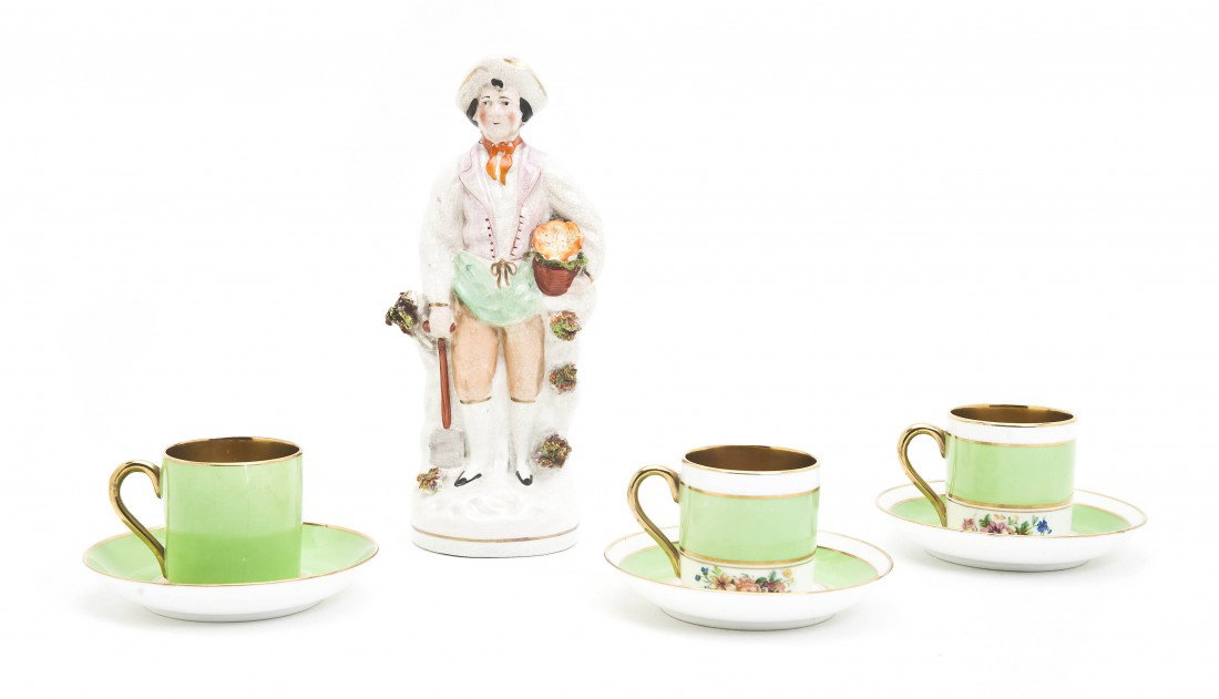 A Staffordshire Figure, Height of first 7 1/2 inc: A Staffordshire Figure, depicting a gardener, together with three English cups and saucers. Height of first 7 1/2 inches. Property from the Leon Brown Trust, U.S. Bank, Trustee, Troy, Ohio