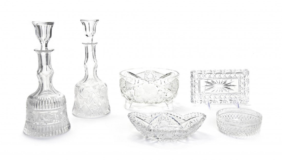 A Collection of Cut Glass Articles, Height of fir: A Collection of Cut Glass Articles, comprising two decanters, a bowl, five trays and a sugar. Height of first 9 1/2 inches. Property from the Leon Brown Trust, U.S. Bank, Trustee, Troy, Ohio