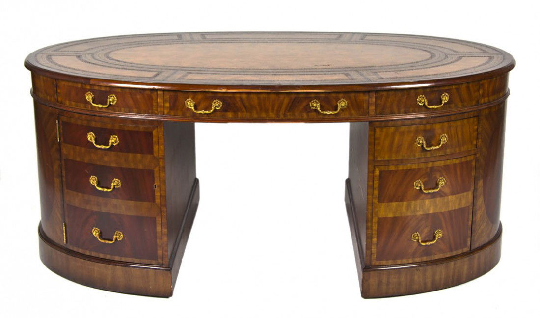 A Mahogany and Marquetry Double Pedestal Partners: A Mahogany and Marquetry Double Pedestal Partners Desk, Maitland-Smith, having an oval leather inset top with a molded edge over the frieze set with opposing drawers, each demilune pedestal fitted wit