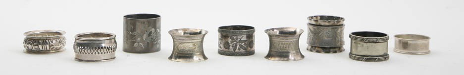 A Collection of Nine Silver and Silverplate Napki: A Collection of Nine Silver and Silverplate Napkin Rings, primarily second half of the 19th century, of various sizes and patterns, two in American sterling, one in English silver and six silverplate 