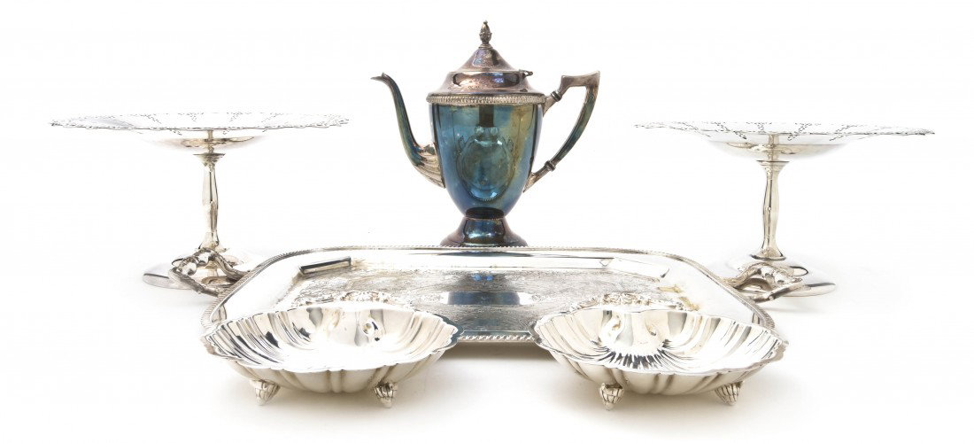 A Collection of American Silverplate Articles, Wi: A Collection of American Silverplate Articles, comprising two rectangular handled trays, a circular table plateau, a teapot, three compotes, two shell shaped dishes and a flower frog. Width of widest 