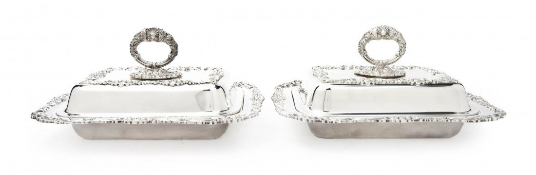 Two English Silverplate Covered Entrees, Dodge In: Two English Silverplate Covered Entrees, Dodge Inc., in the Queen Victoria pattern, each of rectangular form with foliate handles and borders. Width 13 inches. Property from the Leon Brown Trust, U.S.