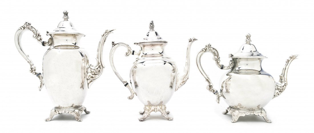 An American Silverplate Tea and Coffee Service, W: An American Silverplate Tea and Coffee Service, William Rogers, comprising a hot water pot, a teapot and a coffee pot. Height of tallest 11 inches. Property from the Leon Brown Trust, U.S. Bank, Trust