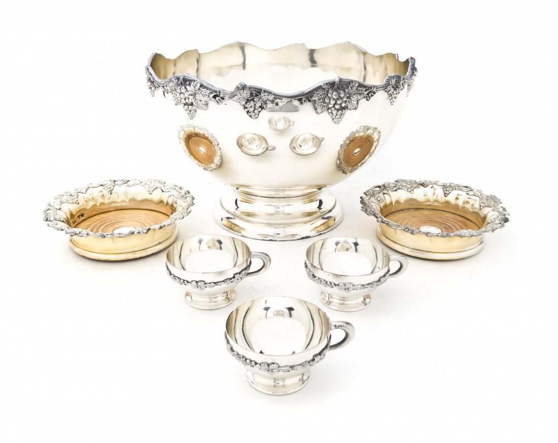 An American Silverplate Punch Bowl Set, Diameter: An American Silverplate Punch Bowl Set, the footed bowl with grapevine decoration having 12 conforming cups, together with 2 wine coasters. Diameter 12 inches. Property from the Leon Brown Trust, U.S.