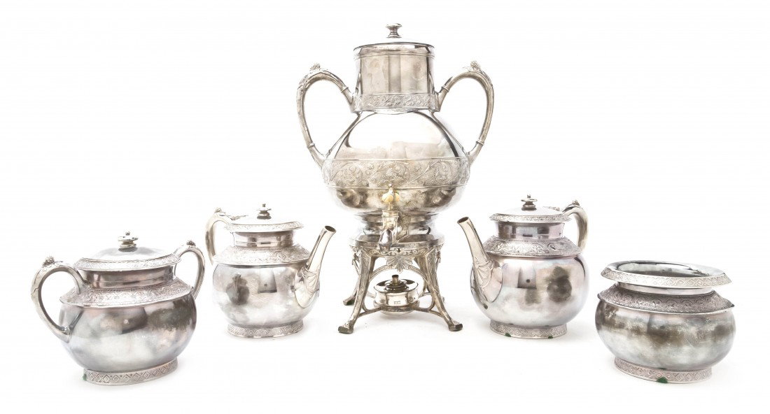 An Aesthetic Silverplate Tea and Coffee Service, : An Aesthetic Silverplate Tea and Coffee Service, comprising a hot water kettle on stand, a teapot, a coffee pot, a covered sugar, a creamer, a waste bowl and tray. Height of first 15 3/4 inches. Prope