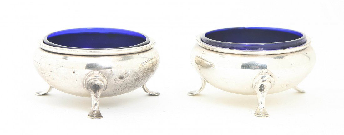 A Pair of American Sterling Silver Salt Cellars, : A Pair of American Sterling Silver Salt Cellars, Gorham, each of circular form raised on cabriole feet having cobalt glass liners; approximate total weighable 2.67 ozt. Height 1 1/2 inches.