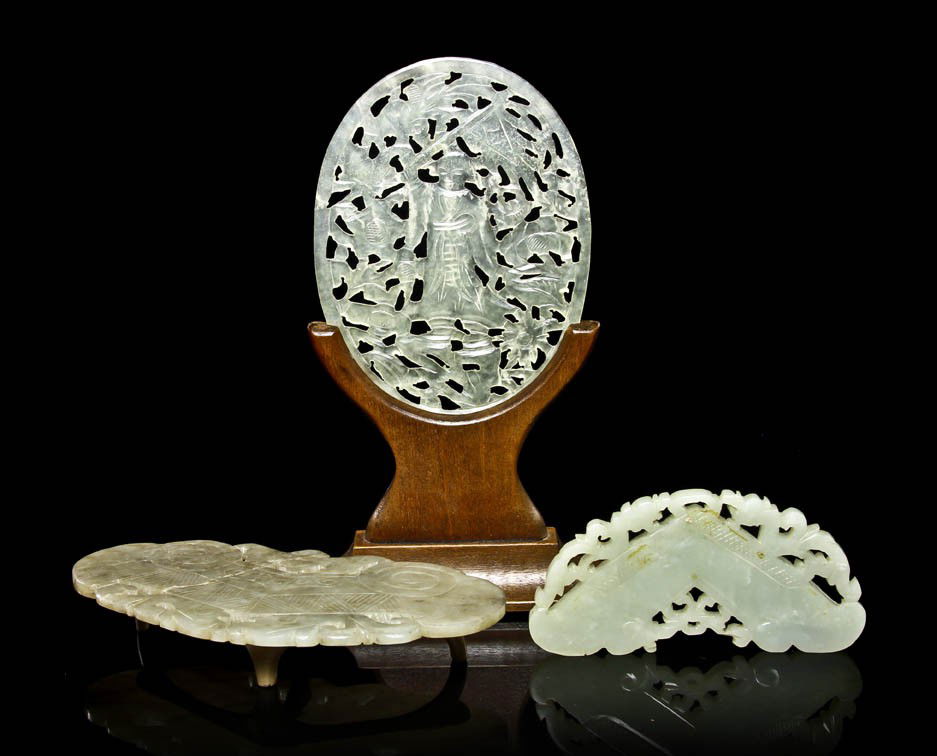 A Group of Three Jade and Hardstone Plaques, Widt: A Group of Three Jade and Hardstone Plaques, comprised of one oval plaque and two in the form of chimes. Width of widest 5 3/4 inches.