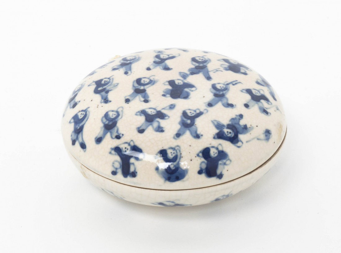 A Chinese Blue and White Ceramic Paste Box, Heigh: A Chinese Blue and White Ceramic Paste Box, having underglaze blue decoration of boys, with a six character underglaze blue Kangxi reign mark on the underside. Height 3 1/2 inches.