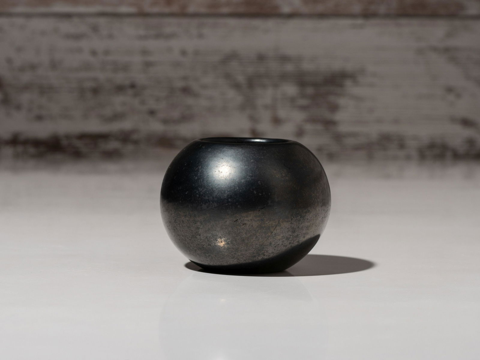 Maria Martinez and Popovi Da (San Ildefonso, 1887-1980 / 1923-1971) Blackware Pottery Bowl, February: Maria Martinez and Popovi Da (San Ildefonso, 1887-1980 / 1923-1971) Blackware Pottery Bowl, February 1970 spherical jar with gunmetal finish; signed and dated on base height 2-1/2 inches x diameter 3-