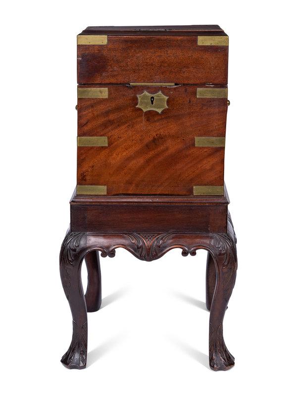 A Regency Brass Mounted Mahogany Cellarette: A Regency Brass Mounted Mahogany Cellarette Circa 1820, The Stand Later affixed to stand. Height overall 23 1/4 x width 12 1/4 x depth 12 1/4 inches. This lot is located in Chicago. Pr