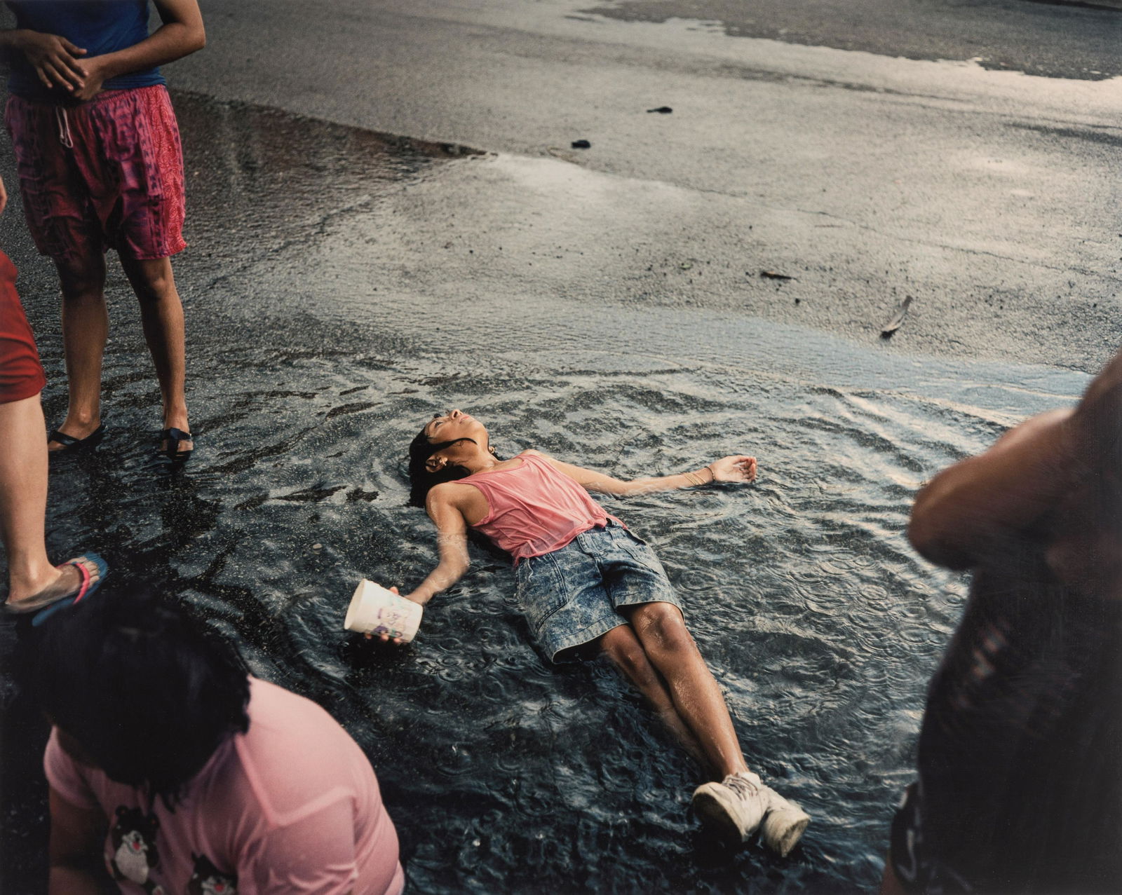 Paul D'Amato (born 1956) Girl in Rain, Chicago, 1991: Paul D'Amato (born 1956) Girl in Rain, Chicago, 1991 Archival pigment print, printed 2006, signed in ink, printed title, date and number '2/10' on gallery label affixed on the frame backing. image: 46
