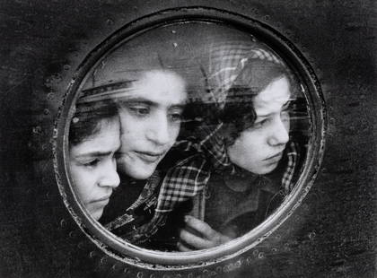 Ruth Orkin (1921-1985) Jewish Refugees at Lydda Airport, Tel Aviv, Israel, 1951: Ruth Orkin (1921-1985) Jewish Refugees at Lydda Airport, Tel Aviv, Israel, 1951 Gelatin silver print, printed later, Estate facsimile signature stamp in the margin; signed, titled, dated by Mary Engel