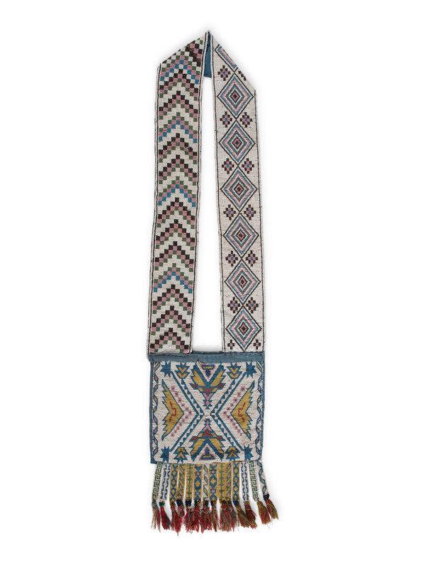 Anishinaabe Child's Loom Beaded Bandolier Bag: Anishinaabe Child's Loom Beaded Bandolier Bag ca 1900 thread-sewn and backed with a blue cotton cloth; strap beaded on one side with a chevron pattern, the other with diamonds in colors of black, ligh