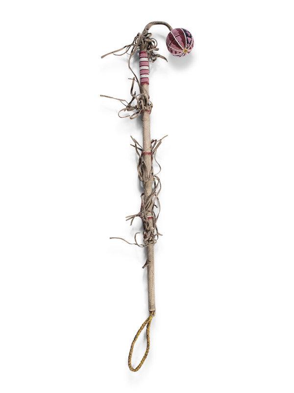 Plains Beaded Flophead Club: Plains Beaded Flophead Club fourth quarter 19th century thread-sewn hide and beaded using colors of pink, rose, cobalt, and white overall length 32 inches This lot is loca