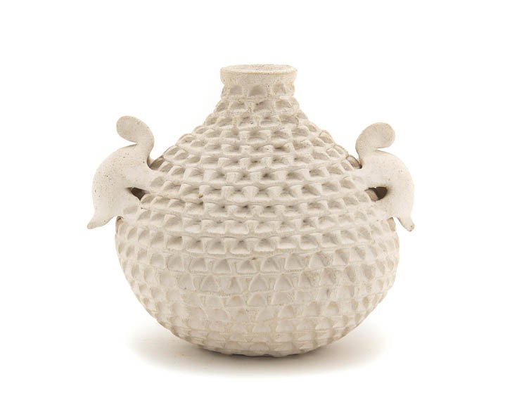 An Acoma Corrugated Effigy Pot, Height 5 1/2 x diam: An Acoma Corrugated Effigy Pot, with two turtles on the shoulder, signed S. Shutiva, Acoma, N.Mex. Height 5 1/2 x diameter 7 inches.
