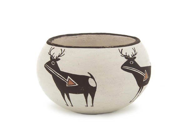 An Acoma Bowl, Height 2 1/2 x diameter 3 1/2 inches: An Acoma Bowl, with heart line deer design, signed Emma Lewis, Acoma. Height 2 1/2 x diameter 3 1/2 inches.