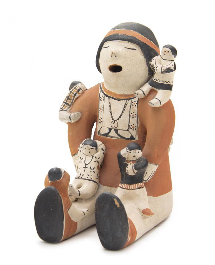 A Cochiti Storyteller, Height 9 x diameter 10 inche: A Cochiti Storyteller, with five children on front and three on back, signed Helen Cordero. Height 9 x diameter 10 inches.