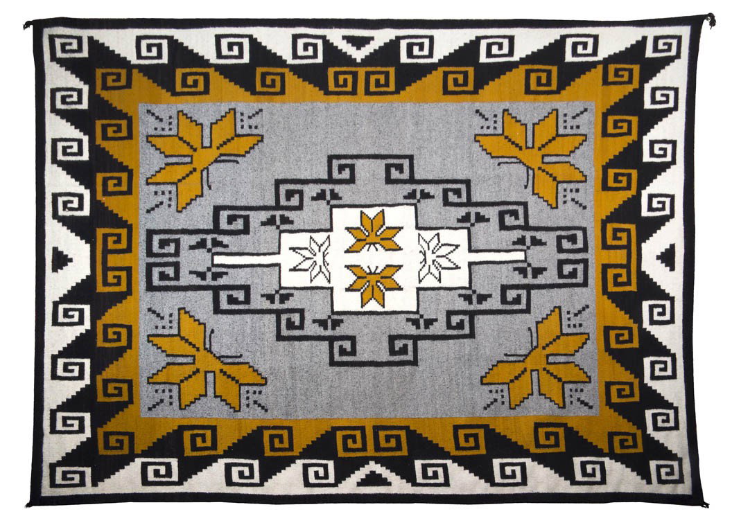 A Pinon Weaving, 83 x 89 inches.: A Pinon Weaving, in black, tan, white and grey with geometric decoration and butterflies in the centerfield, four large butterflies at each corner of the inside hook double border, weaver Elsie Jim. 8