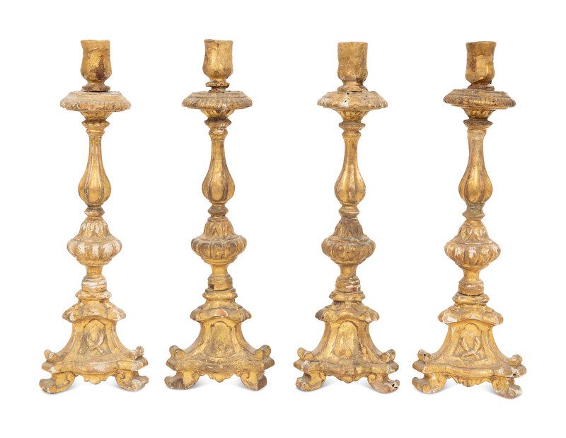 A Set of Four Italian Giltwood Candlesticks: A Set of Four Italian Giltwood Candlesticks 18th Century Height 12 1/2 inches.
