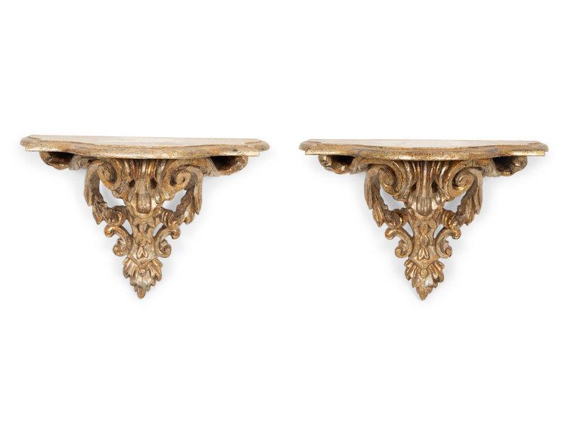 A Pair of Italian Silver Gilt Carved Rococo Style Wall Brackets: A Pair of Italian Silver Gilt Carved Rococo Style Wall Brackets 19th Century Height 15 1/2 x width 22 x depth 10 3/4 inches.