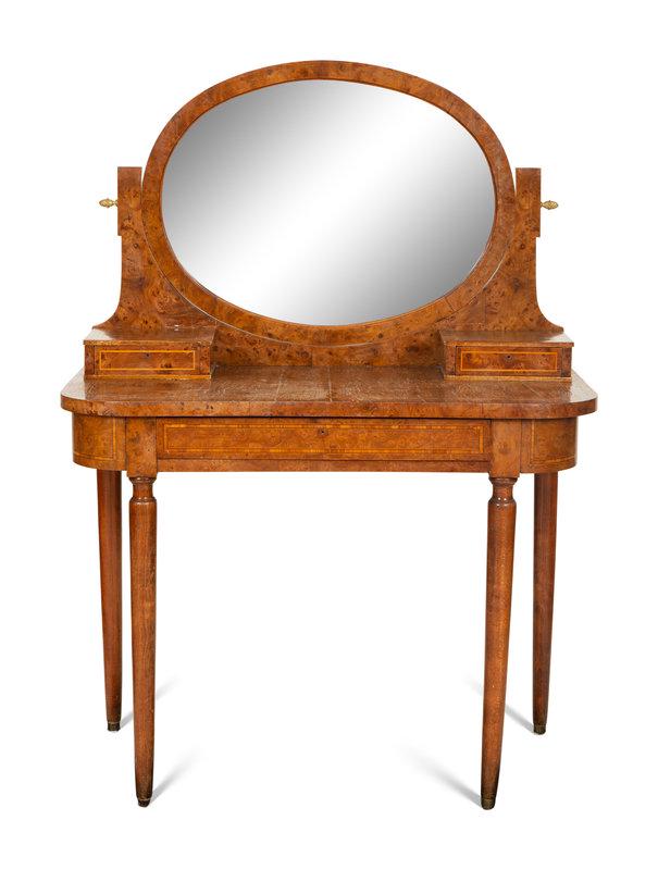 An English Burlwood Dressing Table with Swing Oval Mirror: An English Burlwood Dressing Table with Swing Oval Mirror 19th/20th Century Height 53 1/2 x width 38 1/2 x depth 20 inches. Property from the Estate of Diane Lambert, Palm Beach, Florida