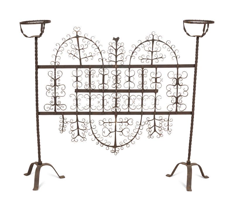 A Mizner Wrought Iron Fire Screen with Candleholders: A Mizner Wrought Iron Fire Screen with Candleholders Early 20th Century Height 43 x width 48 1/2 x depth 11 inches.