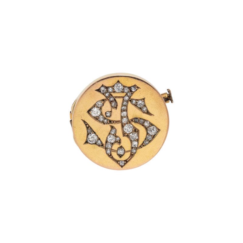ANTIQUE, YELLOW GOLD AND DIAMOND BROOCH: ANTIQUE, YELLOW GOLD AND DIAMOND BROOCH Depicting a diamond monogram containing 40 old mine cut diamonds weighing approximately 1.00 carat total. 3/4 inch wide. Gross weight: 3.45 dwt. Property of