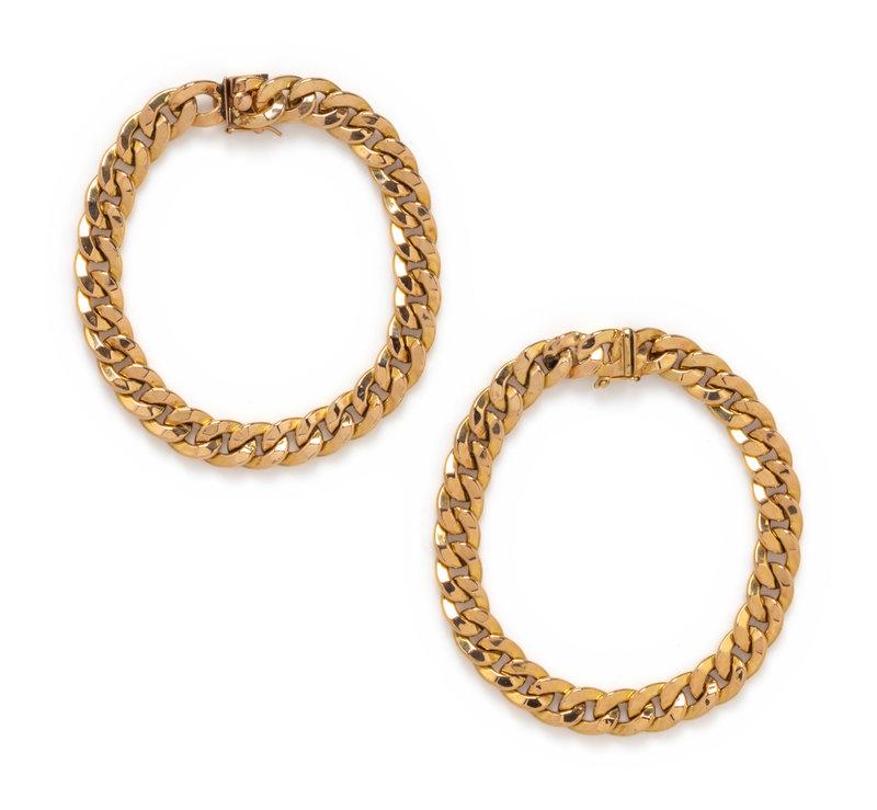 COLLECTION OF YELLOW GOLD BRACELETS: COLLECTION OF YELLOW GOLD BRACELETS Consisting of two hollow curb link bracelets measuring approximately 10.00 mm wide. 8 1/2 and 8 3/4 inches long. Stamp: 14K.Stamp: 14K ITALY ORITALIA.Gross
