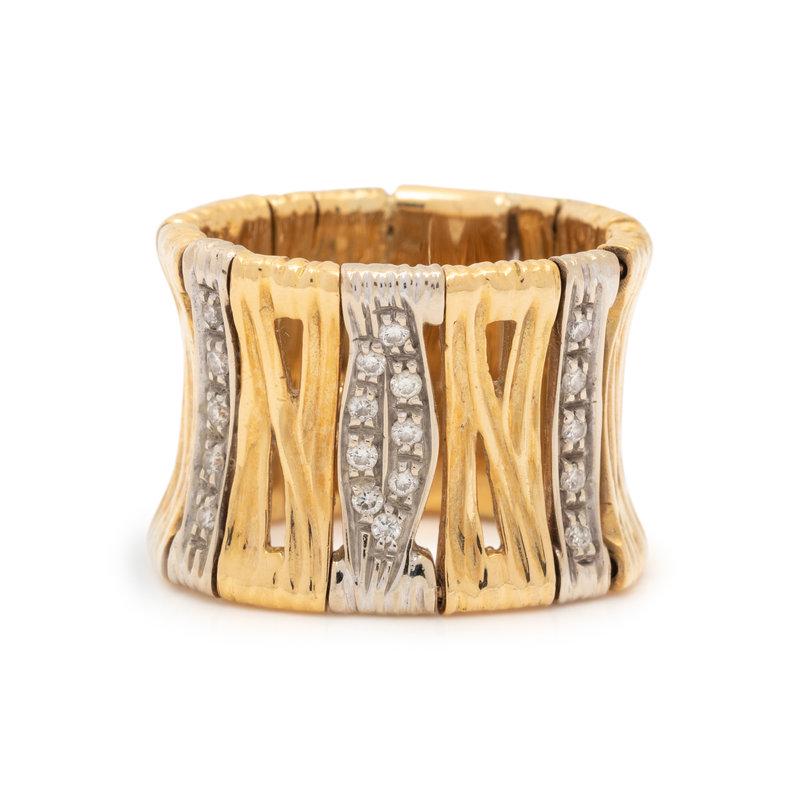 ROBERTO COIN, BICOLOR GOLD AND DIAMOND 'ELEPHANTINO' RING: ROBERTO COIN, BICOLOR GOLD AND DIAMOND 'ELEPHANTINO' RING In a flexible form, containing 19 round brilliant cut diamonds weighing approximately 0.20 carat total and one round mixed cut ruby. Ring size