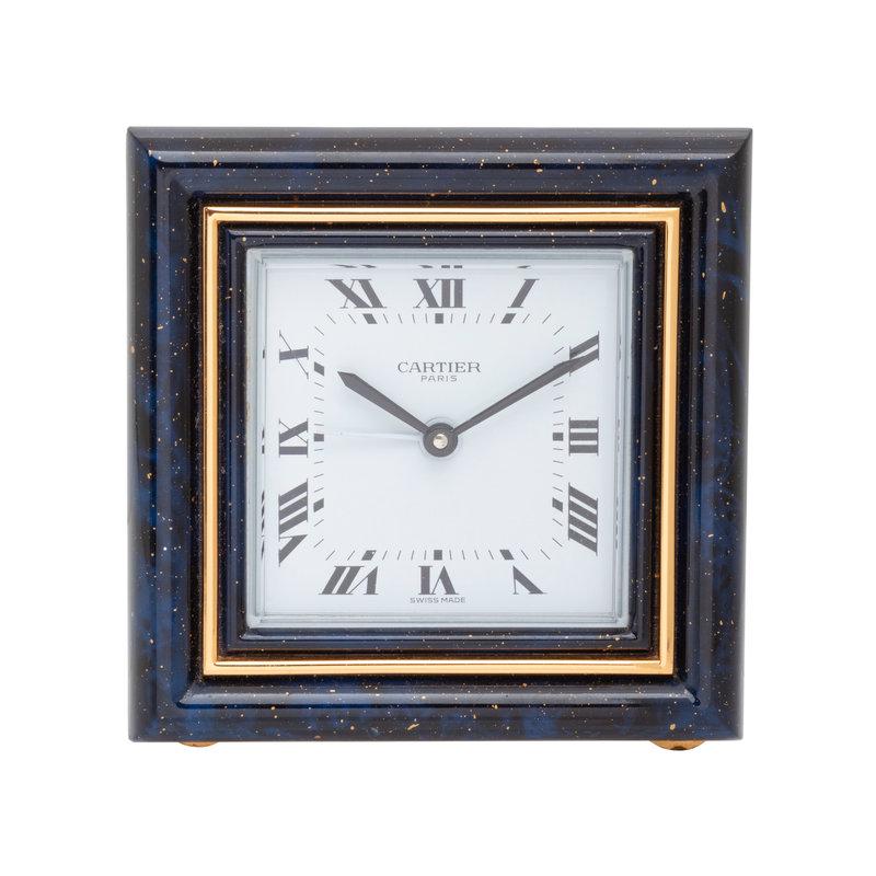 CARTIER, TRAVEL ALARM CLOCK: CARTIER, TRAVEL ALARM CLOCK Maker: Cartier Case size: Approx. 75 x 75 mm Case material: Gilt metal Bezel: Polychrome enam
