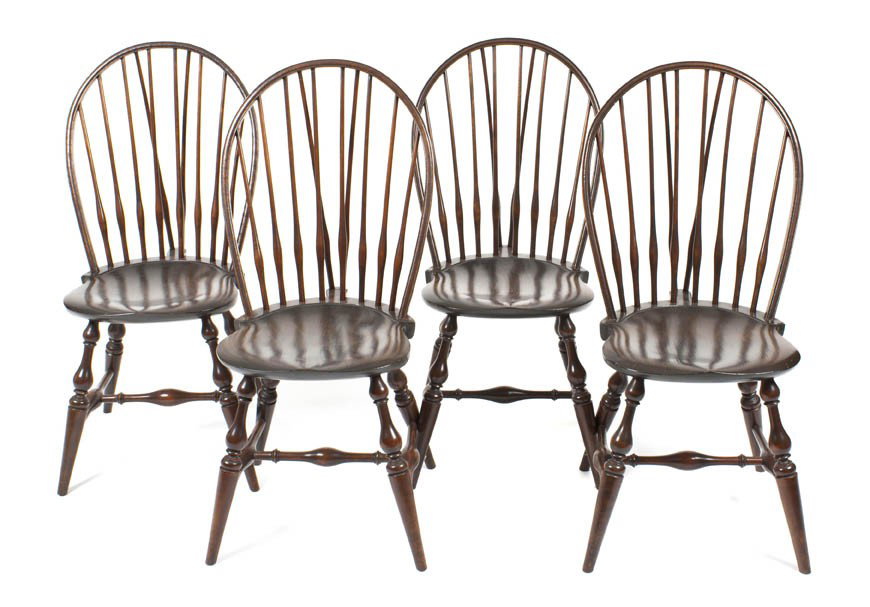 A Set of Four American Windsor Side Chairs, Height : A Set of Four American Windsor Side Chairs, having a shaped crest over a trapezoid seat raised on tapering legs joined by stretchers. Height 38 3/4 inches. Property from the Collection of Olga Hirshho
