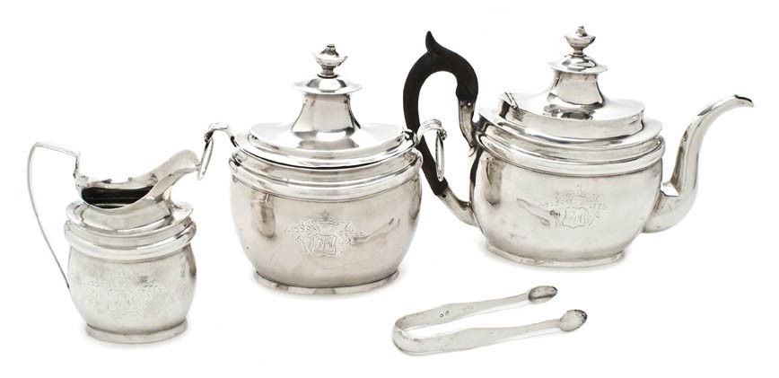 An American Federal Coin Silver Tea Service, John: An American Federal Coin Silver Tea Service, John Wesley Forbes, New York, active 1808-1838, comprising a teapot with an applied wood handle, a creamer and a covered sugar, the oval stepped lids havin