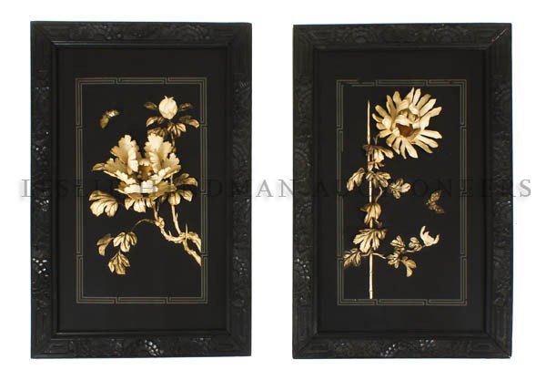 A Pair of Japanese Carved Ivory and Ebonized Wood : A Pair of Japanese Carved Ivory and Ebonized Wood Panels, each of rectangular form, depicting chrysanthemums and the other peonies, contained in foliate carved wood frames. Height 27 5/8 x width 18 in