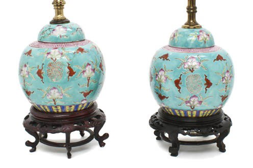 A Pair of Chinese Porcelain Lidded Ginger Jars, He: A Pair of Chinese Porcelain Lidded Ginger Jars, of bulbous form, having decoration of iron red colored bats throughout atop a turquoise ground, raised wood stands and mounted as lamps. Height overall 