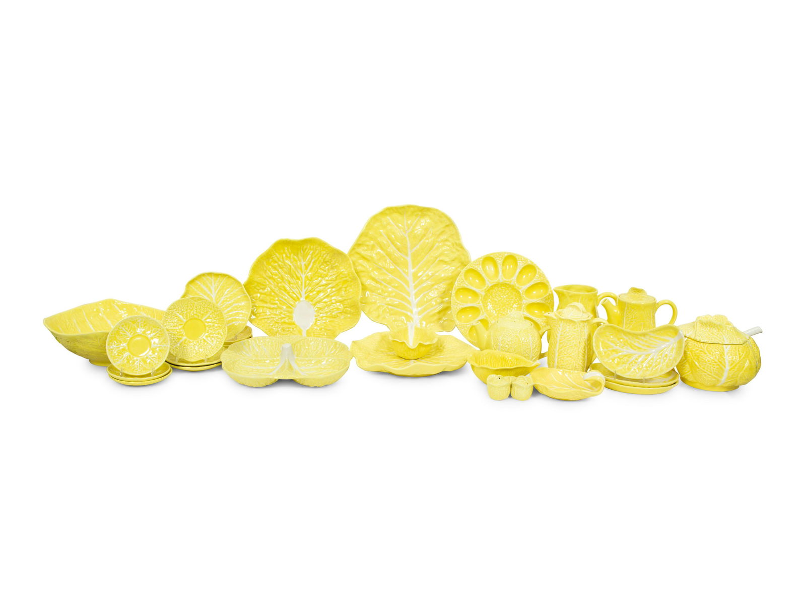An Extensive Portuguese Yellow Ceramic Lettuce Ware Dinner Service: An Extensive Portuguese Yellow Ceramic Lettuce Ware Dinner Service 20th Century comprising: 29 dinner plates 24 salad plates 19 bread plates 9 cake plates 8 dessert plates 19 bone dishes 8 fruit bowls