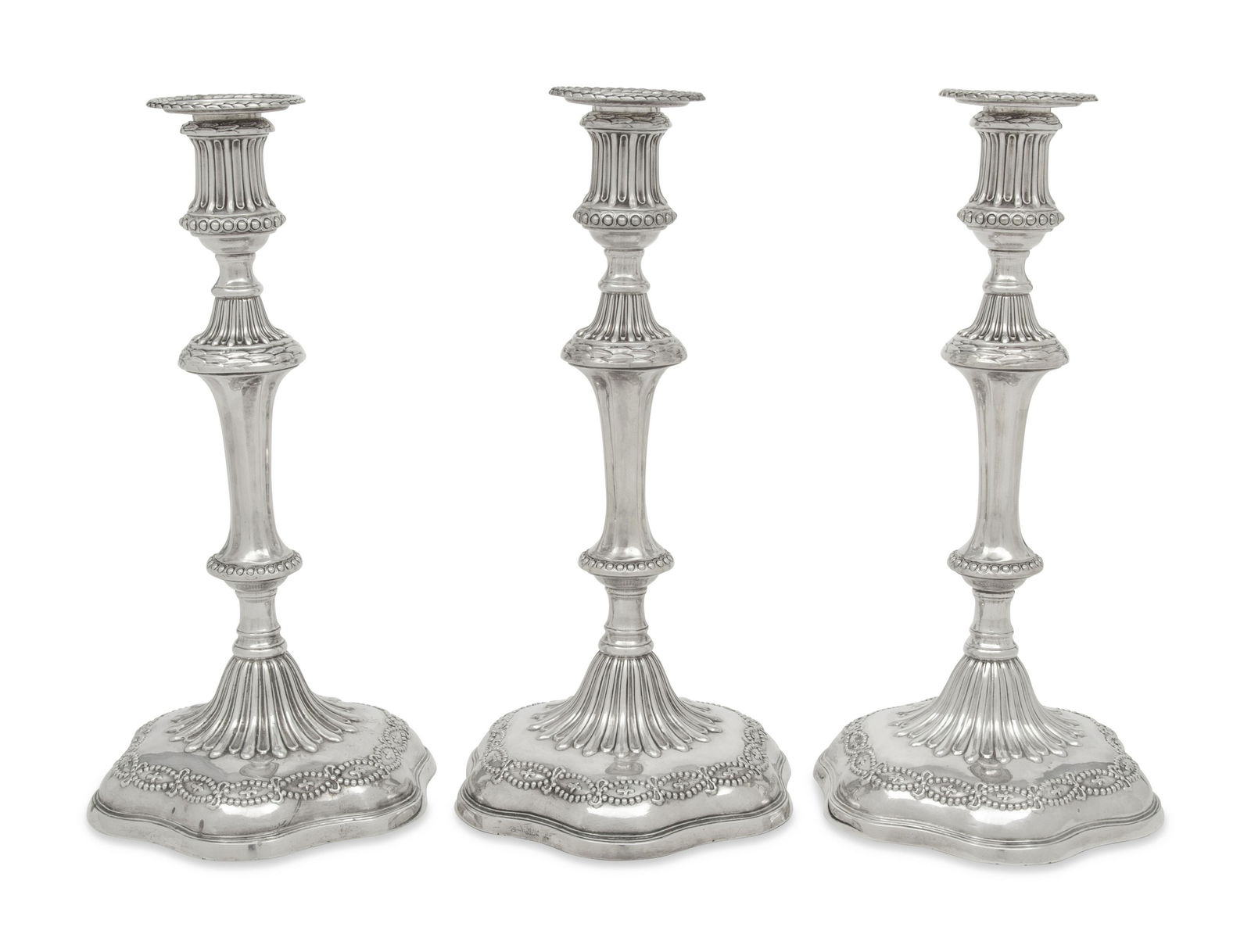 A Set of Three George III Silver Candlesticks (1 of 5)