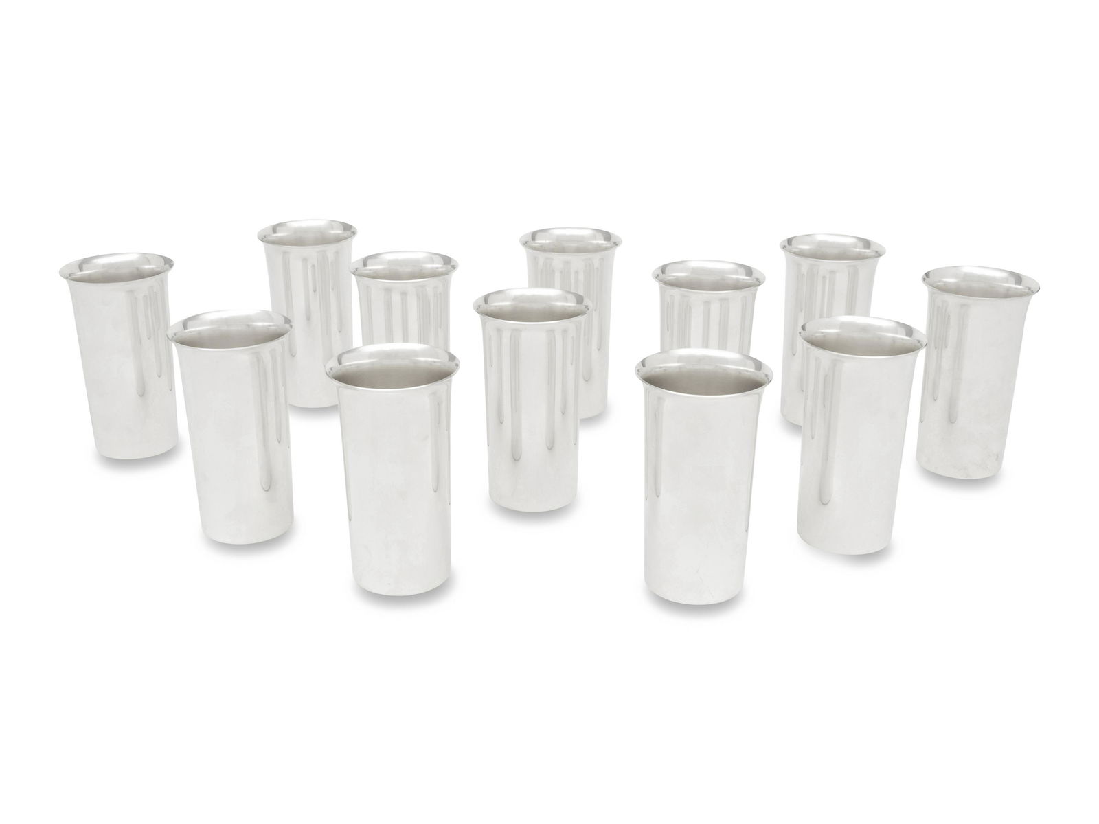 A Set of Twelve American Silver Tumblers: A Set of Twelve American Silver Tumblers Wallace Silversmiths, 20th Century each marked 'Sterling' and numbered '234' to underside 59 ozt 3 dwt Height 5 1/4 inches. This lot is located in Chicago. Pro