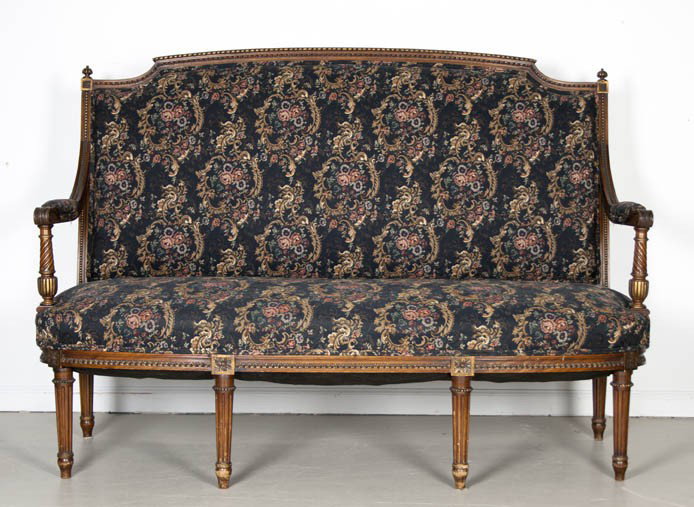 A Louis XV Style Parcel Gilt Settee, Height 42 5/: A Louis XV Style Parcel Gilt Settee, having carved finials and acanthus leaf decoration to the arms, raised on fluted and tapering legs. Height 42 5/8 x width 57 1/2 x depth 25 inches.