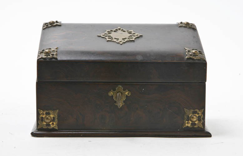 A Burlwood and Gilt Metal Mounted Stationery Box,: A Burlwood and Gilt Metal Mounted Stationery Box, having a hinged lid opening to a fitted interior, raised on a molded base. Height 3 3/4 inches.