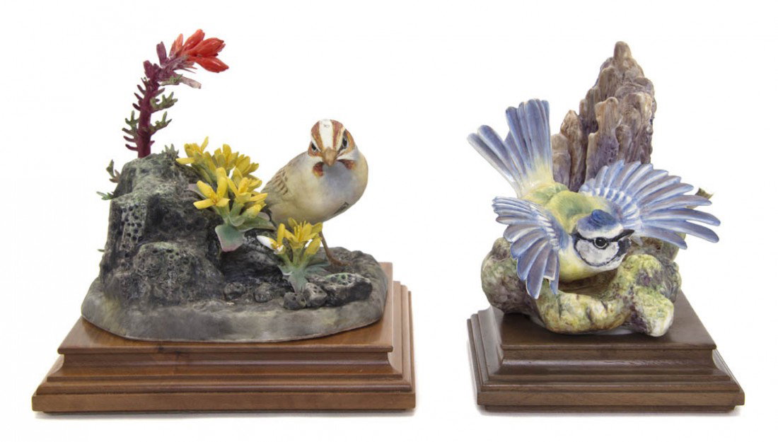 Two Royal Worcester Dorothy Doughty Birds, Lark S: Two Royal Worcester Dorothy Doughty Birds, Lark Sparrow and Blue Tit Parus, the first depicted perched on a flowering volcanic ash formation, the second a rock formation. Height of taller 6 1/2 inches