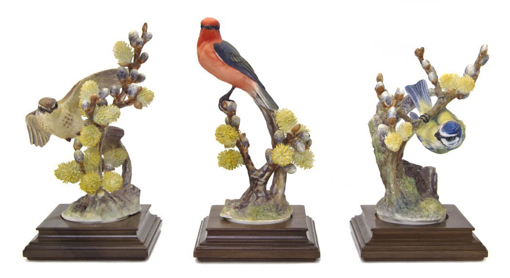 A Group of Three Royal Worcester Dorothy Doughty : A Group of Three Royal Worcester Dorothy Doughty Birds, Vermillion Flycatchers and Blue Tit, each perched on a pussy willow branch. Height of tallest 9 1/8 inches.