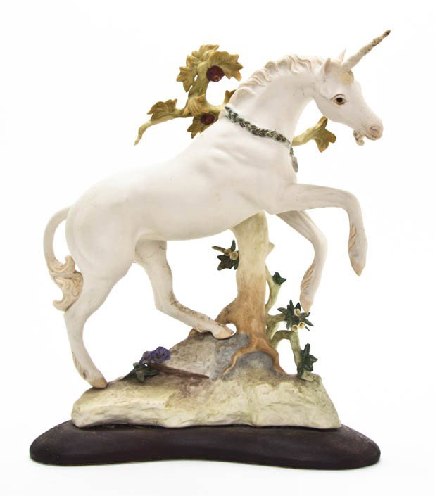 A Cybis Porcelain Figure, Height 12 3/4 inches.: A Cybis Porcelain Figure, depicting a unicorn standing before an apple tree raised on a naturalistic base, signed and numbered 395. Height 12 3/4 inches. Property from the Collection of Ernie Diebold,