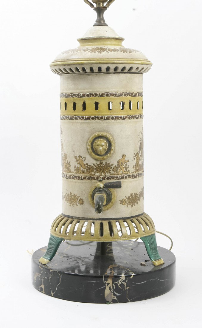 A Continental Tole Kettle, Height overall 35 inch: A Continental Tole Kettle, with gilt putti and floral decoration raised on three feet, further raised on a circular marble base mounted as a lamp. Height overall 35 inches. Property from the Collectio