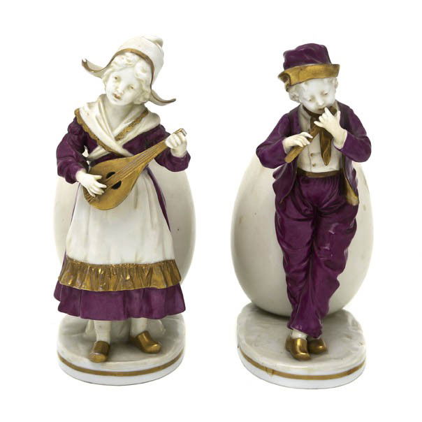 A Pair of Capodimonte Porcelain Figural Spill Vas: A Pair of Capodimonte Porcelain Figural Spill Vases, each depicting a child musician standing before the ovoid shaped vase, having crowned N marks. Height 7 1/2 inches.
