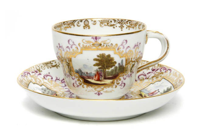 A Meissen Topographical Cup and Saucer, Marcolini: A Meissen Topographical Cup and Saucer, Marcolini, with gilt and polychrome decoration, having starred crossed swords mark in underglaze blue. Diameter of saucer 5 1/2 inches.