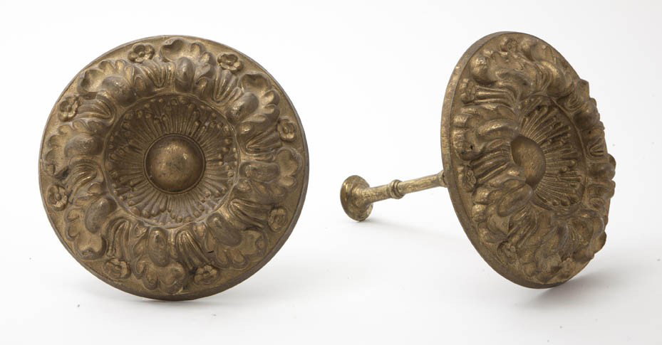A Pair of Pressed Gilt Metal Curtain Tiebacks, Di: A Pair of Pressed Gilt Metal Curtain Tiebacks, each of circular form modeled with foliate decoration. Diameter 5 3/4 inches.