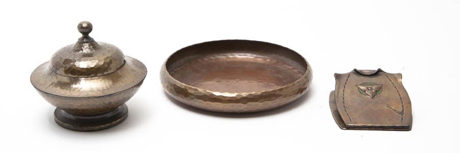A Group of Three Roycroft Hammered Copper Article: A Group of Three Roycroft Hammered Copper Articles, comprising a paper clip, a circular dish and an inkwell. Diameter of largest 4 7/8 inches.